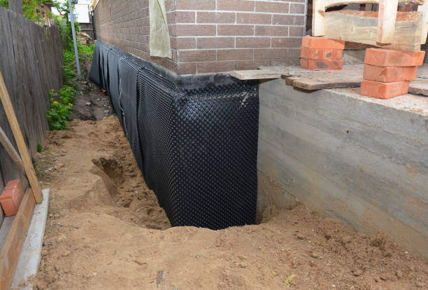 Happy homeowners after waterproofing job in Mount Meigs
